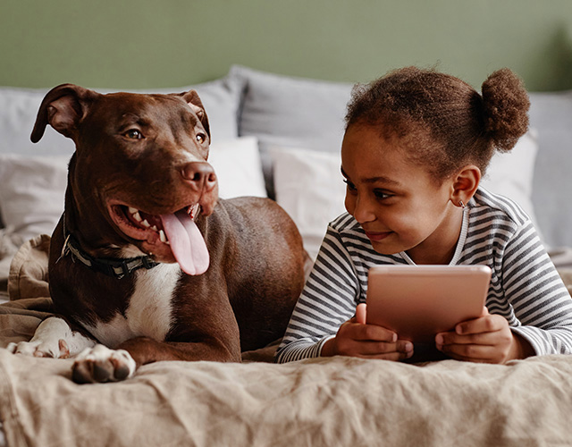 Girl playing with dog