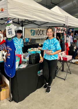 Youth volunteers helping at VOCAL's tent