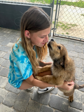 Youth volunteer with puppy