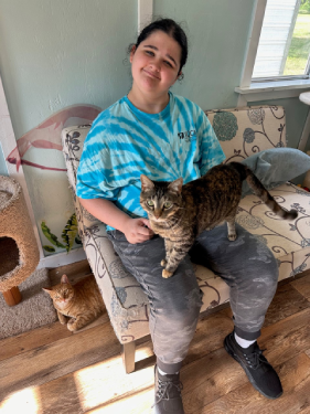 Youth council volunteer with cats