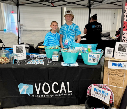 Two youth volunteers at fundraising event